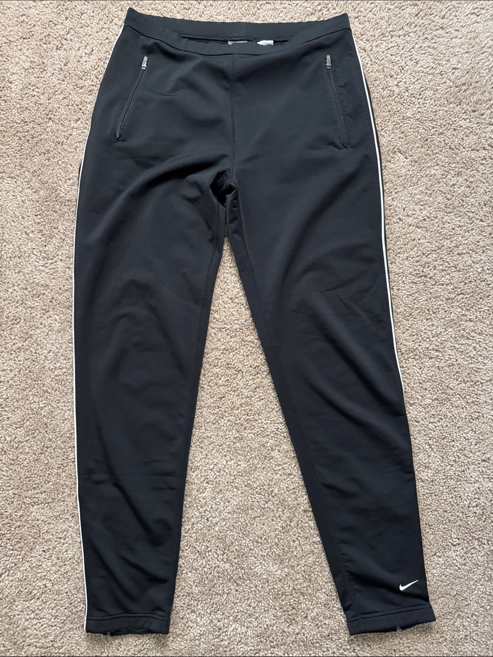 Nike Black Athletic Pants with White Care Tag Detail